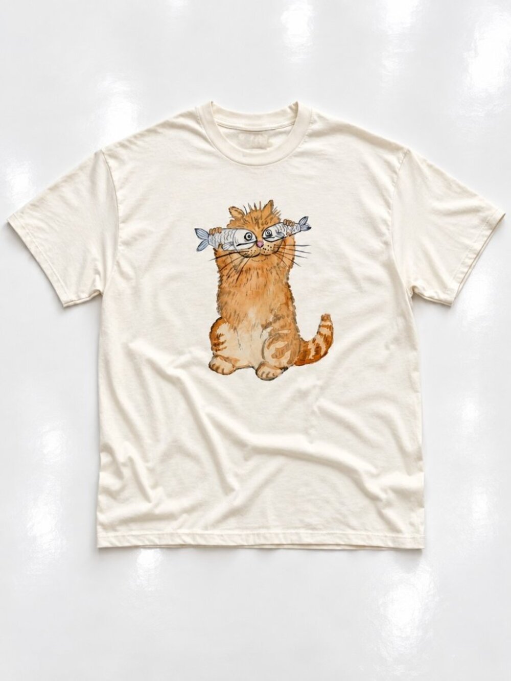 Orange Cat Holding Fish Graphic Cream Gildan T-Shirt